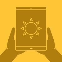 Hands holding tablet computer glyph color icon. Weather forecast app. Silhouette symbol. Tablet computer with sun. Negative space. Vector isolated illustration