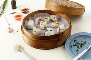 selective focus of chinese steamed dimsum or chinese food in bamboo container photo