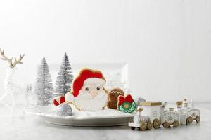 White Christmas Concept, Santa Claus Cookies with Icing Sugar . Copy Space for Text and Advertisement photo