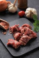 Fresh Beef Raw Meat Slice on Stone Plate for Sukiyaki, Shabu, Yakiniku, or Korean Barbeque BBQ photo