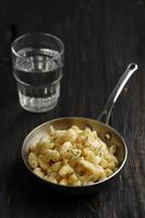 Mac and Cheese, American Style Macaroni Pasta with Cheesy sauce and Crunchy breadcrumbs Topping on Dark Rustic Table