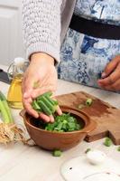 Sliced, chopped spring onions, salad onions, green onions or scallions in a bowl photo