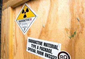 Radiation label beside the transport wooden box Type A package photo