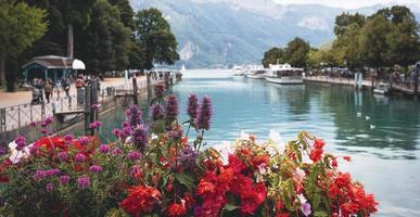 the view of city canal with medieval buildings in Annecy Old Town, Restaurant near the River Thou in Old Town,The building looks great in middle of a large city. photo