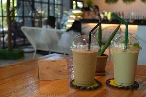 Cups of cafe and drinks in coffee shop photo