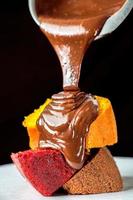 Slice cake with chocolate close-up photo