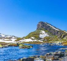 Amazing Storehodn mountain peak at Hydnefossen waterfall river Hemsedal Norway.