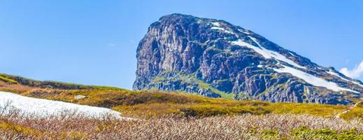 Amazing Storehodn mountain peak at Hydnefossen waterfall river Hemsedal Norway.