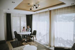 Father and daughter drinking tea together at the room photo