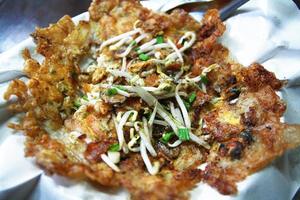 Oysters fried in egg batter. Thai mussel or crispy pancake. photo