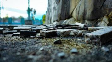 a pile of bricks scattered on the ground photo