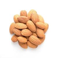 Close up of almonds pile isolated on white background.Above view.Almond is a soure of protein ,Omega 3 and mineral. photo