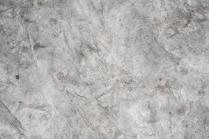 Old grey concrete cement wall texture background.Abstract wallpaper.Granite wallstone.Scratch dark surface.Interior room structure.Loft style. photo