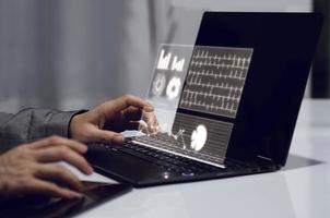 business woman holding hand on laptop photo