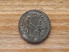 Ancient Roman denarius coin reverse showing emperor Hadrian rest photo