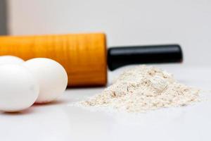 Rolling Pin with Eggs and Flour photo