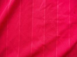 textura de jersey de tela de ropa deportiva roja foto