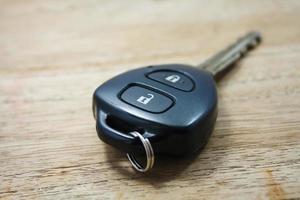 Car key on wooden background photo