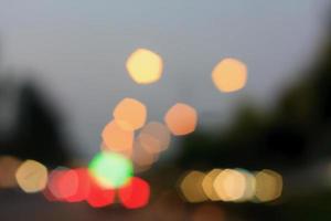 beautiful background of bokeh lights at night on road with car photo