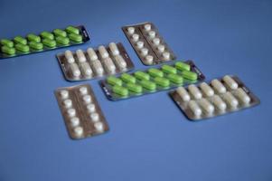 Tablets, drugs of various shapes and colors in blisters. Treatment, Health, medicine, prescription. photo