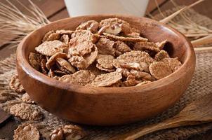 Healthy breakfast - whole grain muesli with a walnut in a wooden bowl photo