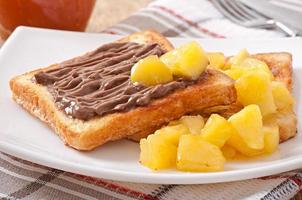 French toast with caramelized apples and chocolate cream for breakfast photo