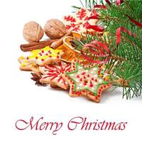 Christmas cookies, spices and spruce branches isolated on white background photo