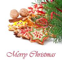 Christmas cookies, spices and spruce branches isolated on white background photo