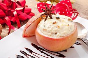 Baked apples with honey cream cheese, raisins and nuts photo