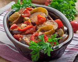 Steamed vegetables - eggplant, peppers and tomatoes photo