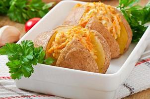 Baked potatoes stuffed with minced chicken and carrots photo