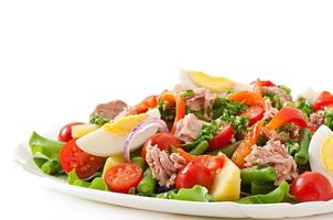 Salad with tuna, tomatoes, potato and onion photo