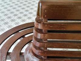 brown wooden plank chair in station for traval railway. antique wood pattern rusty textured. photo