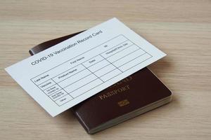 Passport and immunization record card for travel photo