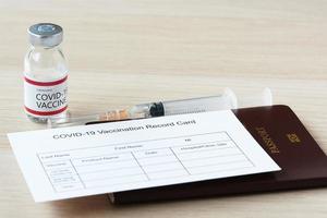 Passport and immunization record card for travel photo