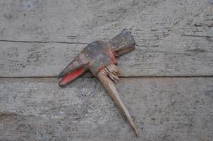 A broken hammer in a building site photo