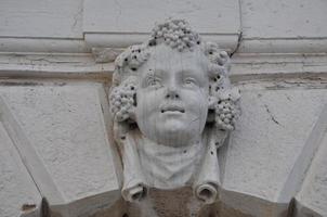 Ancient mask in Venice, Italy photo