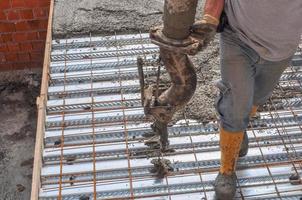 Detail of construction works in a building site with reinforced photo