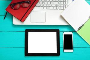 Workplace with business objects on blue wooden table. Top view and copy space photo