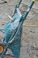 Wheelbarrow hand propelled vehicle in a building site photo