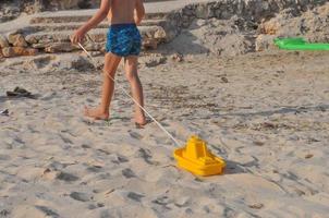 boy with toy boat with copy space photo