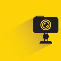 camera on stand icon yellow background vector illustration