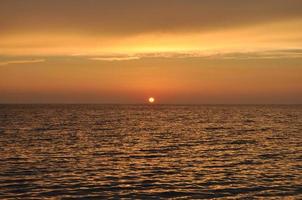 sunset by the sea in sardinia photo