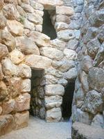 Ruins of ancient Sunuxi Nuraghe megalithic building in Sardinia, photo