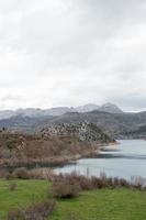 Vertical shot of a beautiful landscape at Caldas de Luna, Leon. Water reservoir and hills. Spain photo