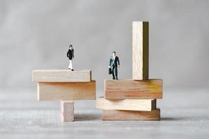 Risk business concept, business man stands on wooden blocks. risk control and managment idea photo