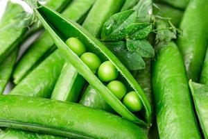 Beautiful close up of green fresh peas and pea pods. Healthy food