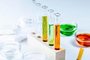 The concept of studying chemistry. Test tubes and reagents on a white background photo