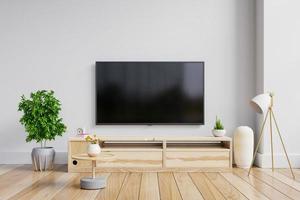 LED TV on the cabinet in modern living room on white wall background. photo
