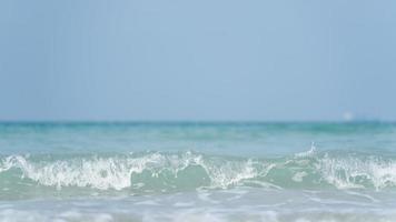 Sea waves on the beach island in the morning. The sea in the morning, the weather is bright, the sunlight has beautiful waves on the island. photo